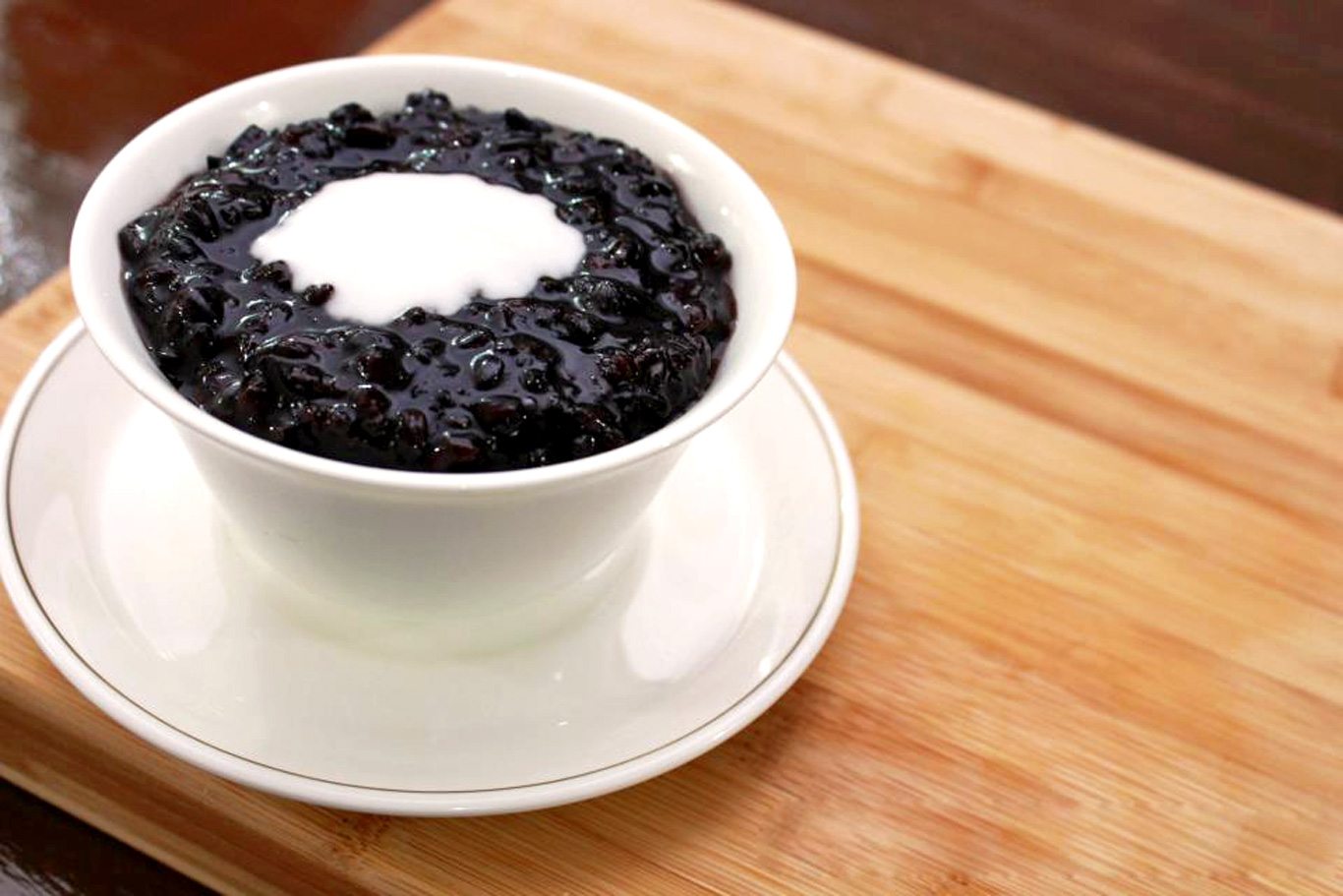 Black glutinous rice pudding with coconut milk